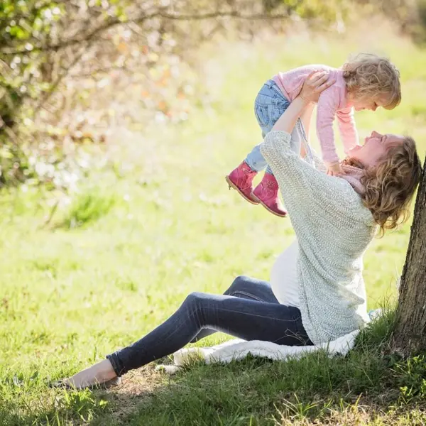 Woman Holding Toddler