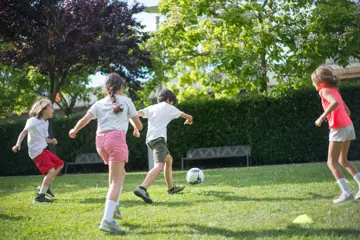 Children Playhing Football