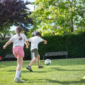 Children Playhing Football