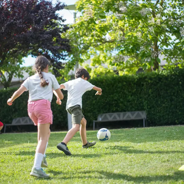 Children Playhing Football