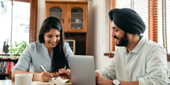 Couple Looking At Laptop