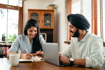 Couple Looking At Laptop