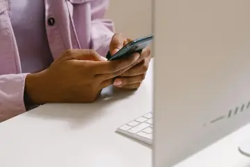 Woman On Phone Near Computer