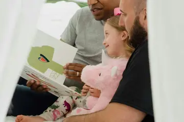 Men Reading To Child