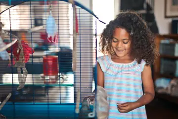 Girl Next To Bird Cage