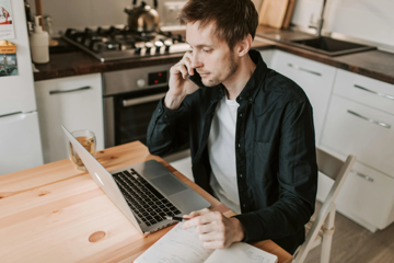 Man On Laptop And Computer