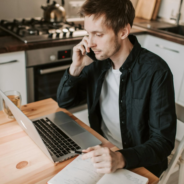 Man On Laptop And Computer