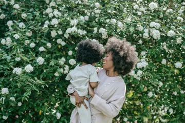 Woman Carrying A Child