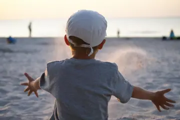 Boy Throwing Sand