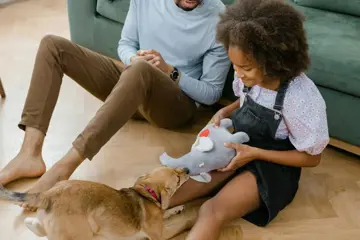 Girl Playing With Dog